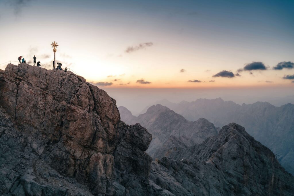 mountain trail hikers sunrise golden hour