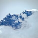 mountain peak summit clouds modern