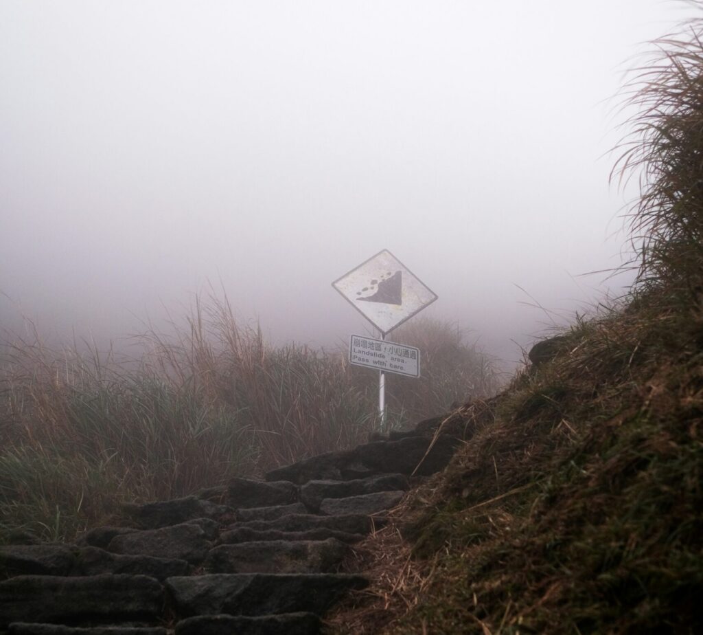 mountain path foggy morning uncertainty