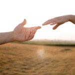 giving hands sunset meaningful